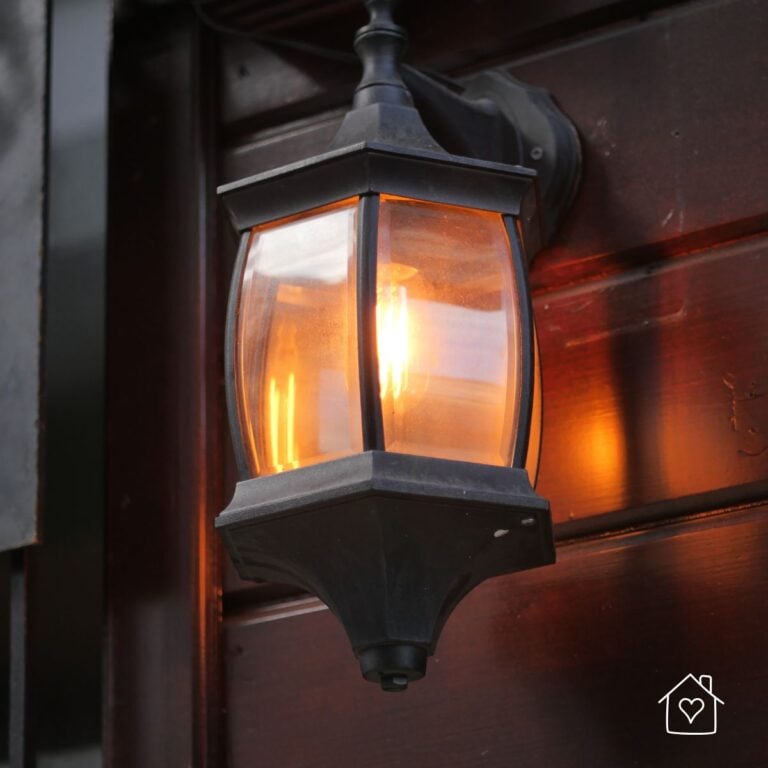 Outdoor light - black fixture with a yellowish light at dusk