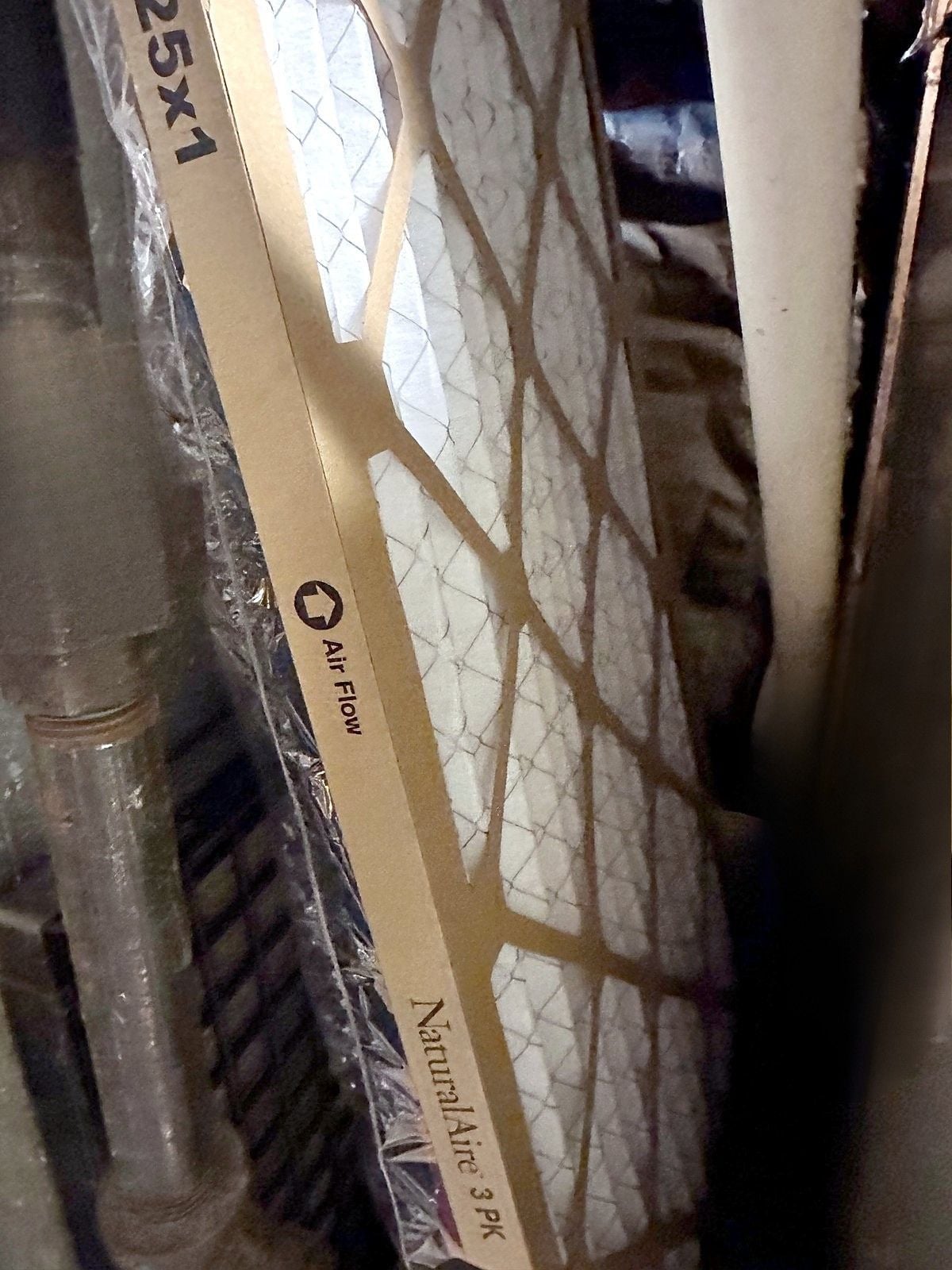 New NaturalAire 25x1 pleated furnace air filter with the airflow arrow printed on the cardboard frame